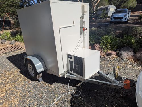 Low profile walk-in coolroom trailer that fits under carports